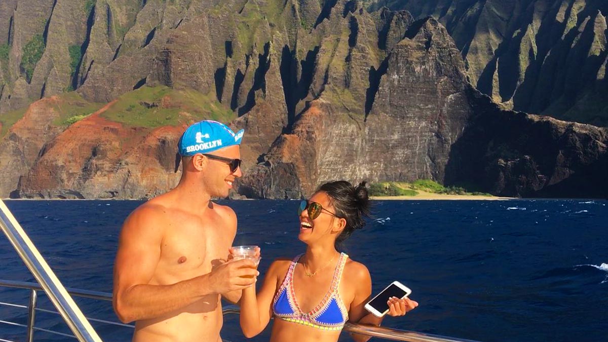 A stolen photograph of a couple relaxing on a yacht during their stay or vacation.
